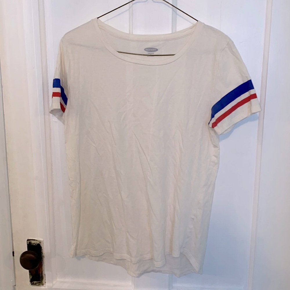 creamy-white t-shirt with red and blue striped sleeves